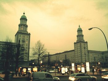 Vehicles on road along buildings