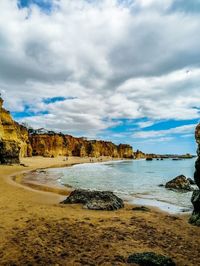 Scenic view of beach against sky