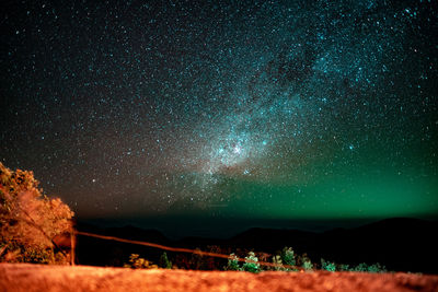 Scenic view of star field against sky at night