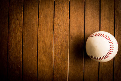 High angle view of ball on wooden floor