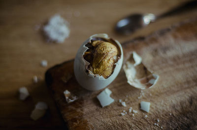 High angle view of balut on cutting board