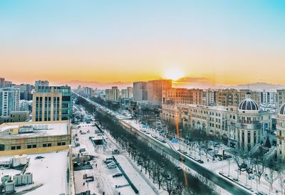 High angle view of city at sunset