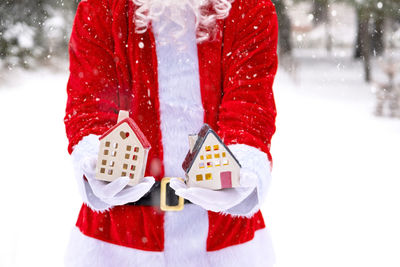 Midsection of woman standing on snow