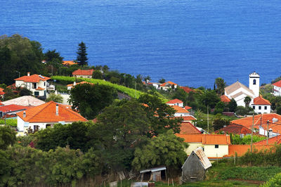 Built structures against calm blue sea