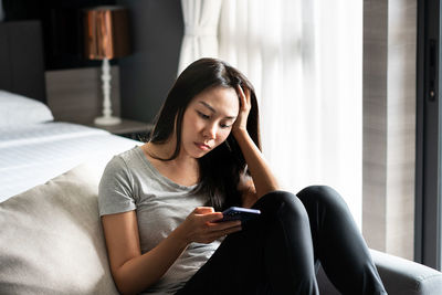 Young woman using mobile phone