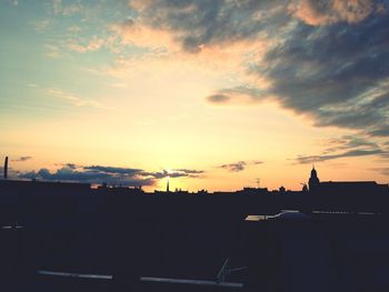 Silhouette of built structure at sunset