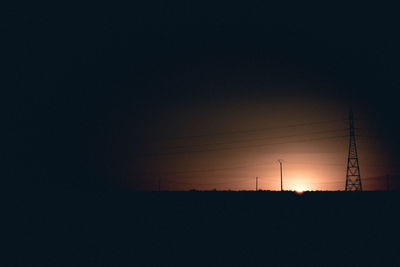 Silhouette landscape against clear sky during sunset