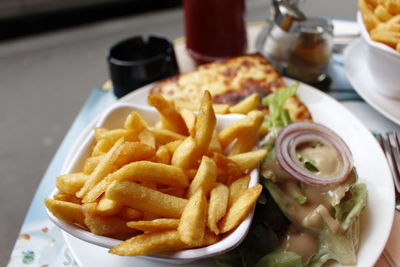 High angle view of french fries in plate on table