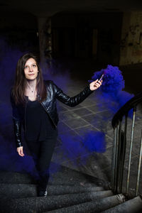 Portrait of beautiful woman at night