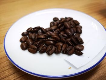 Close-up of coffee beans on table