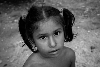 Close-up portrait of cute shirtless girl