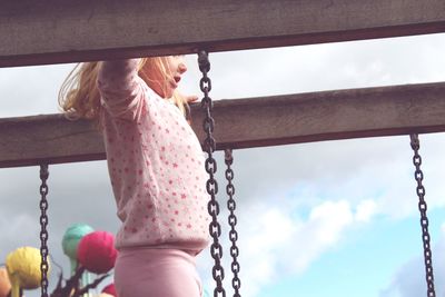 Midsection of girl playing in playground