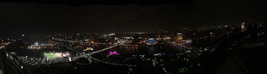 High angle view of illuminated buildings in city at night