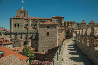 Old buildings in town against sky