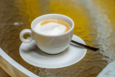 High angle view of coffee cup on table