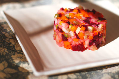 High angle view of chopped slices in plate on table