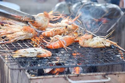 Close-up of meat on barbecue grill