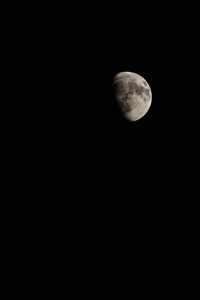 Low angle view of moon against clear sky at night