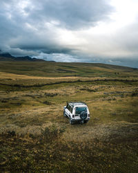 Car on land against sky