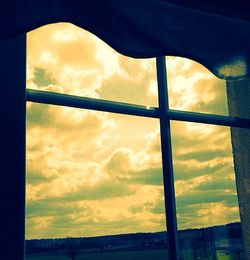 Low angle view of cloudy sky at sunset