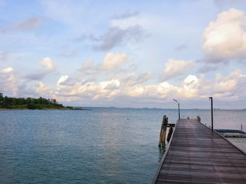 Pier over sea against sky