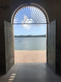 View of sea seen through window