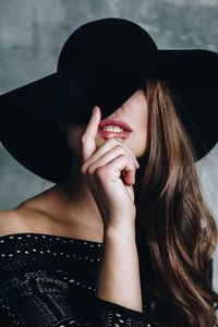 Close-up of woman wearing hat