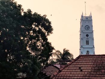 Low angle view of clock tower against sky