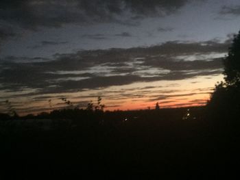 Scenic view of silhouette landscape against sky at sunset