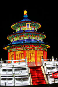 Low angle view of illuminated building against clear sky