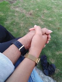 High angle view of couple holding hands