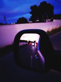 Reflection on side-view mirror of car