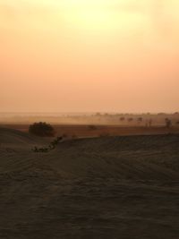 Scenic view of landscape against sky during sunset