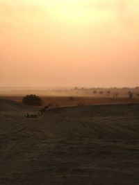 Landscape against sky during sunset