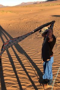 Rear view of man standing on land