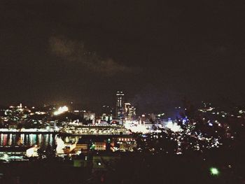 Illuminated cityscape at night