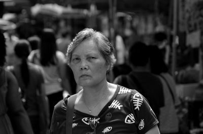Portrait of woman standing at market