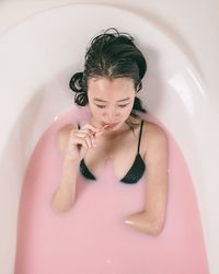 Close-up of young woman in bathroom