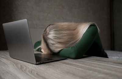 Woman using laptop on table