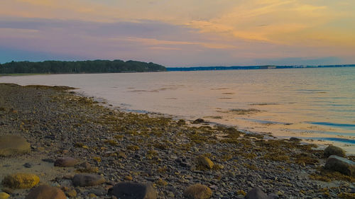 Scenic view of sea against sky at sunset