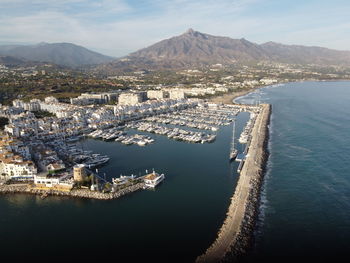 High angle view of city by sea