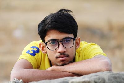 Portrait of young man wearing eyeglasses