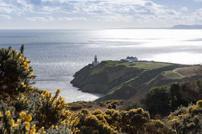 Scenic view of howth lighthouse with the irish sea in the background