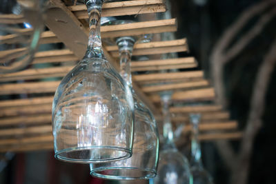 Close-up of light bulb hanging from glass