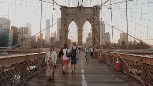 Tourists in front of modern bridge