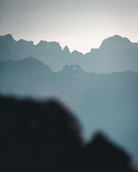 Scenic view of silhouette mountains against clear sky