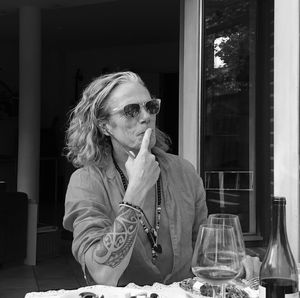 Portrait of young woman sitting at restaurant