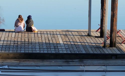 Full length of woman standing by railing