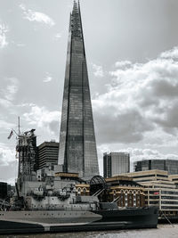 Modern buildings in city against sky