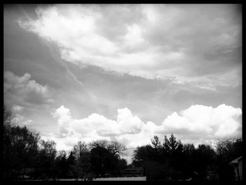 Scenic view of landscape against cloudy sky